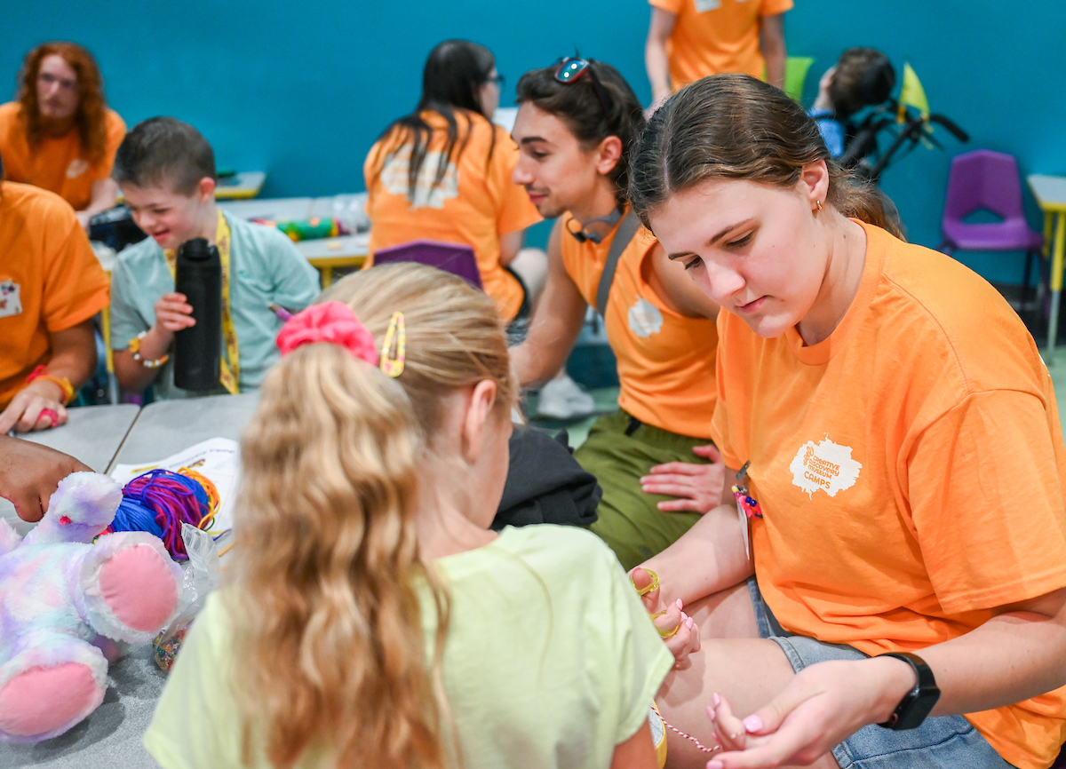 Psychology students work with Friends Discovery Camp campers Thursday, June 12, 2025 at the Creative Discovery Museum.