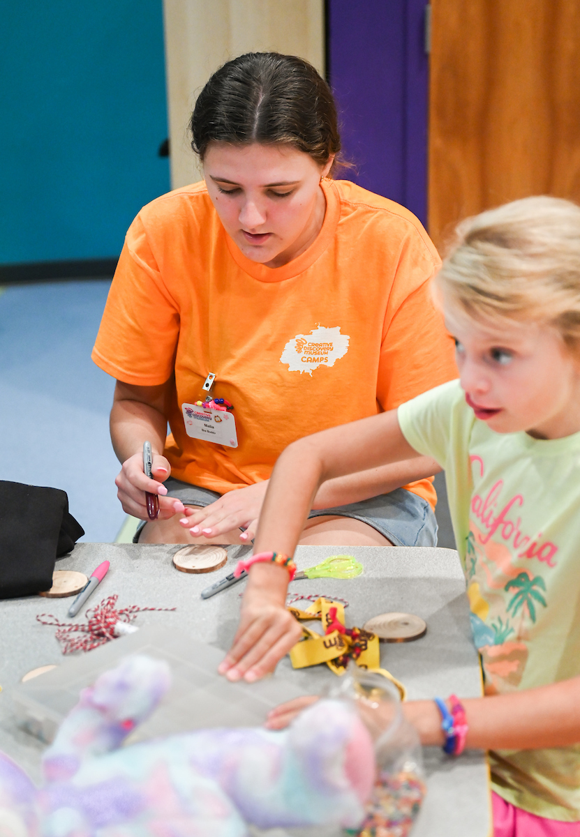 Psychology students work with Friends Discovery Camp campers Thursday, June 12, 2025 at the Creative Discovery Museum.