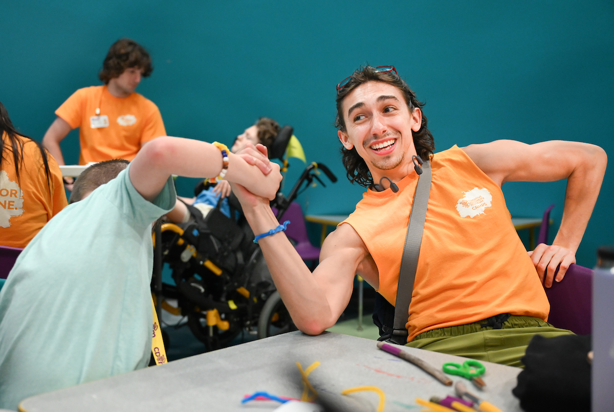 Psychology students work with Friends Discovery Camp campers Thursday, June 12, 2025 at the Creative Discovery Museum.