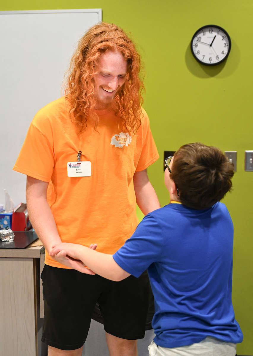 Psychology students work with Friends Discovery Camp campers Thursday, June 12, 2025 at the Creative Discovery Museum.