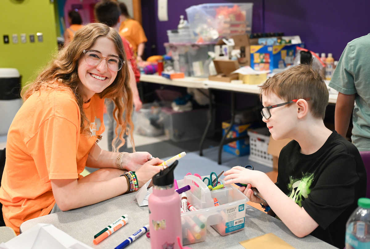 Psychology students work with Friends Discovery Camp campers Thursday, June 12, 2025 at the Creative Discovery Museum.