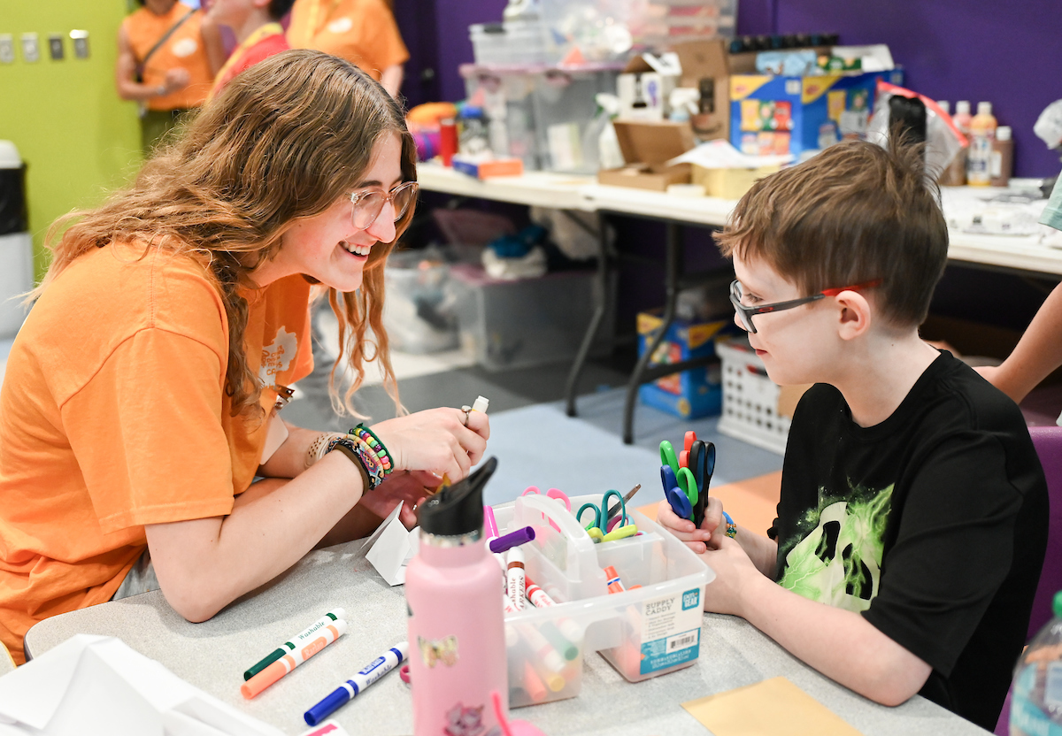 Psychology students work with Friends Discovery Camp campers Thursday, June 12, 2025 at the Creative Discovery Museum.