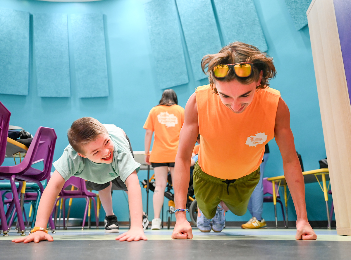 Psychology students work with Friends Discovery Camp campers Thursday, June 12, 2025 at the Creative Discovery Museum.