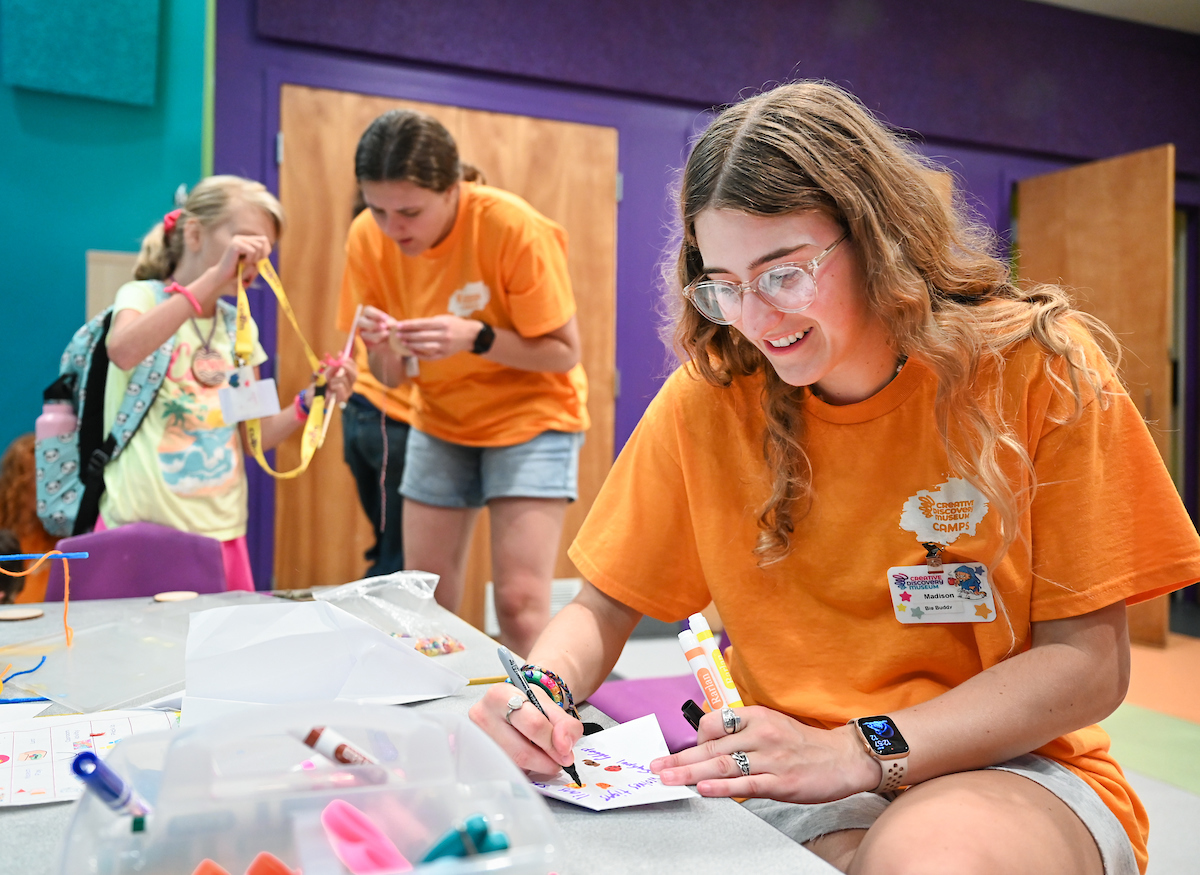 Psychology students work with Friends Discovery Camp campers Thursday, June 12, 2025 at the Creative Discovery Museum.