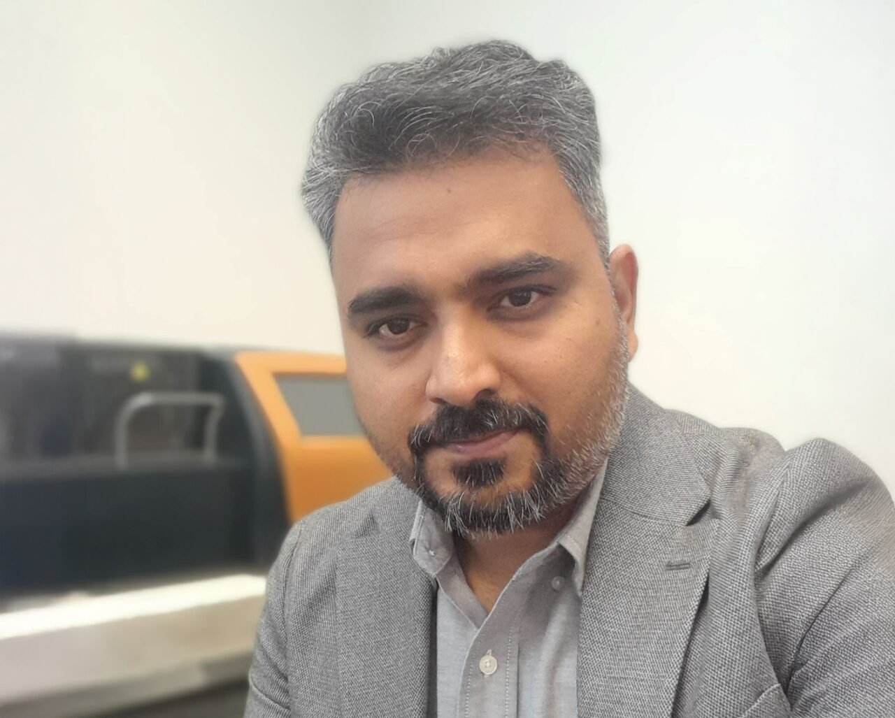 Portrait photo of Dr. Rahul Bhosale sitting in his lab