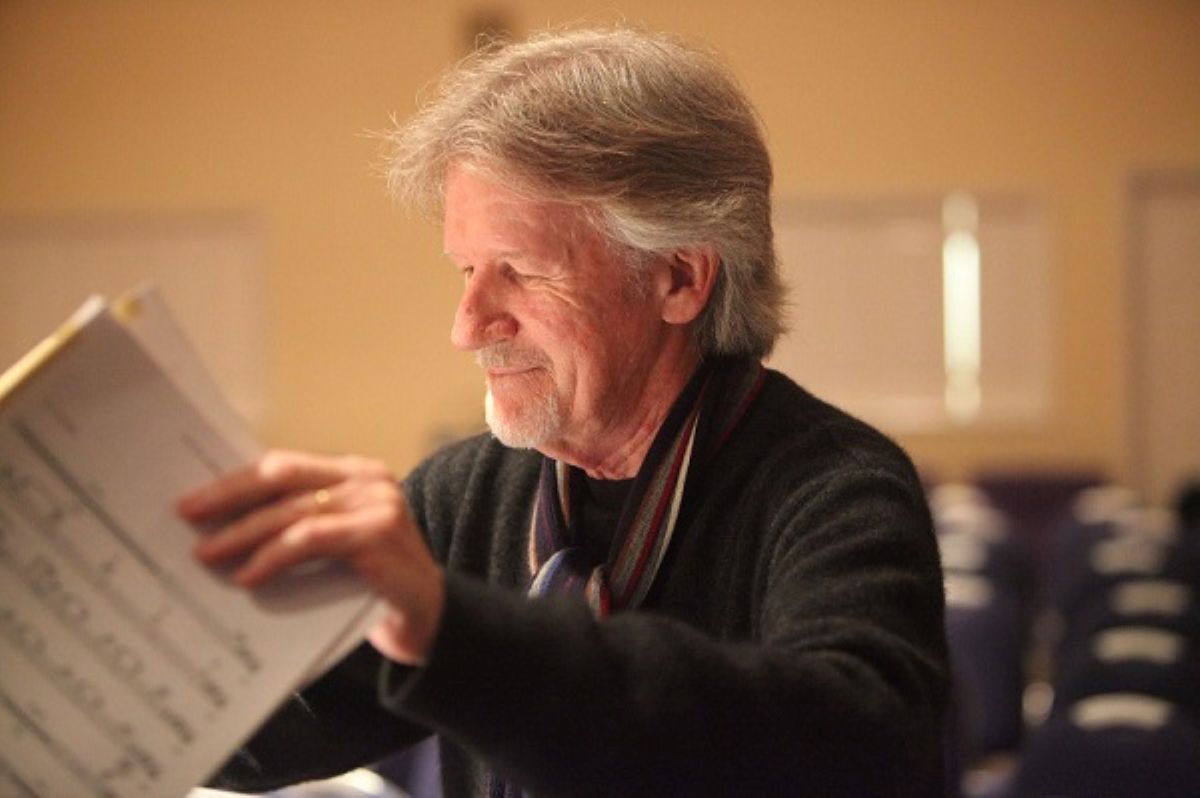 Alan Broadbent looking down at sheet music