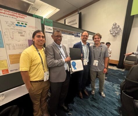 Julio Gonzalez, Dr. Abdel Karrar, TVA's Mark Bowman and Andrew Adams stand with their Prize Paper certificate