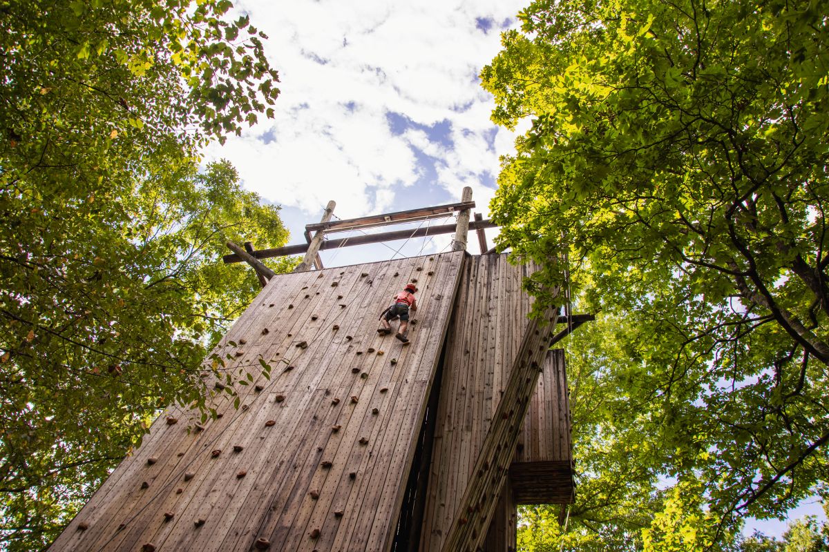 Camper climbing a wall at Camp Ocoee