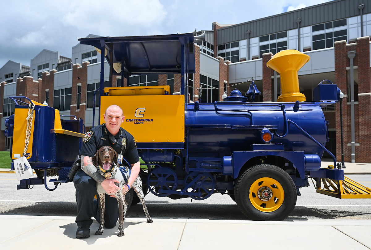 Gunny poses with his owner Sean O'Brien, UTC's police chief. Photo by Angela Foster.