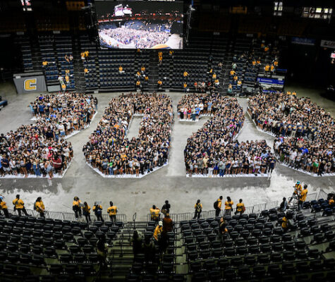 The Class of 2029 stands on the McKenzie Arena floor in the the shape of the numbers "2029"