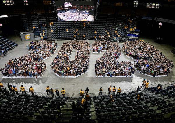 The Class of 2029 stands on the McKenzie Arena floor in the the shape of the numbers "2029"