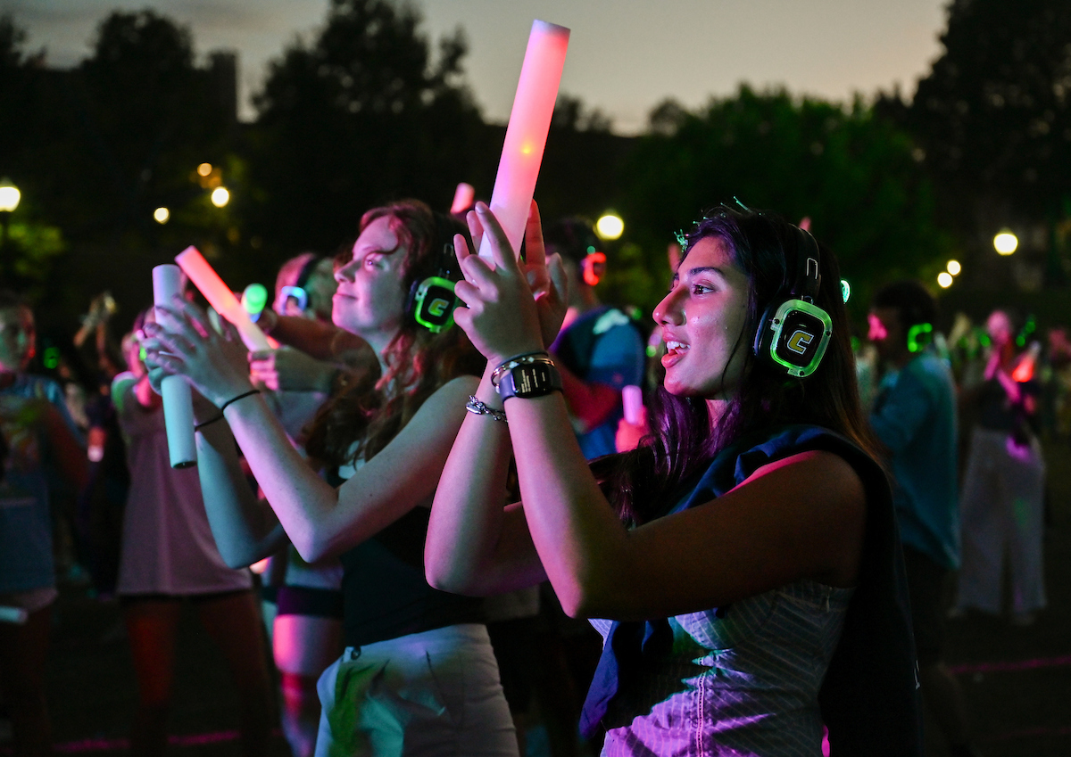 Students dancing on Chamberlain Field at Headphone Dance Party.