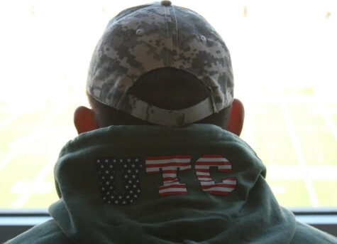 Back of a UTC military-affiliated veteran with a red, white and blue UTC-lettered sweatshirt