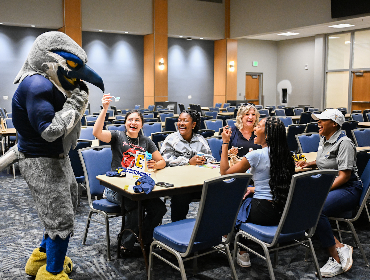 A group of students, Chancellor Lori Bruce, and Scrappy at Snow cones and send-offs