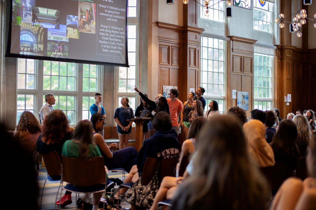 People in the Guerry Center watching a Powerpoint talking about the different City as Text locations