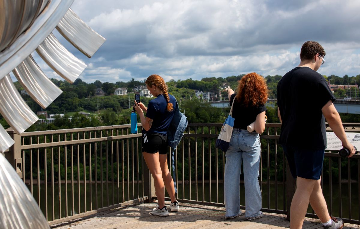 Two students at a railing looking out from the Hunter Museum