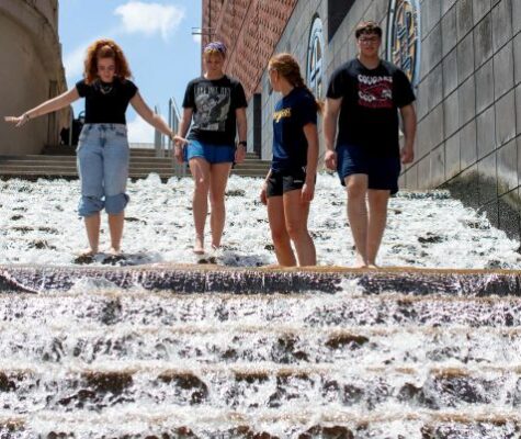 Honors College students Izebella Lamb, Summer Wilson, Lilliana Jessen and Andrew Capelety stand on the famous downtown Chattanooga "water steps."