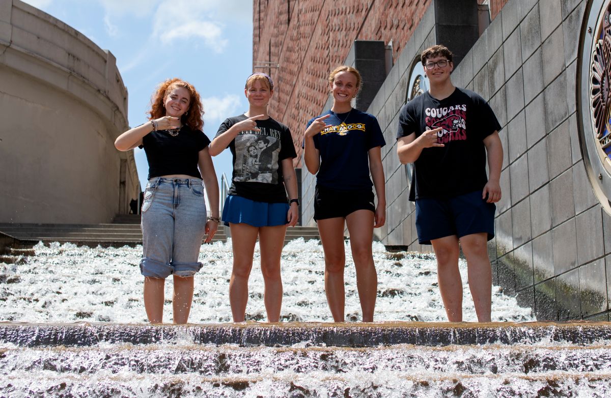 Honors College students Izebella Lamb, Summer Wilson, Lilliana Jessen and Andrew Capelety stand on the famous downtown Chattanooga "water steps."