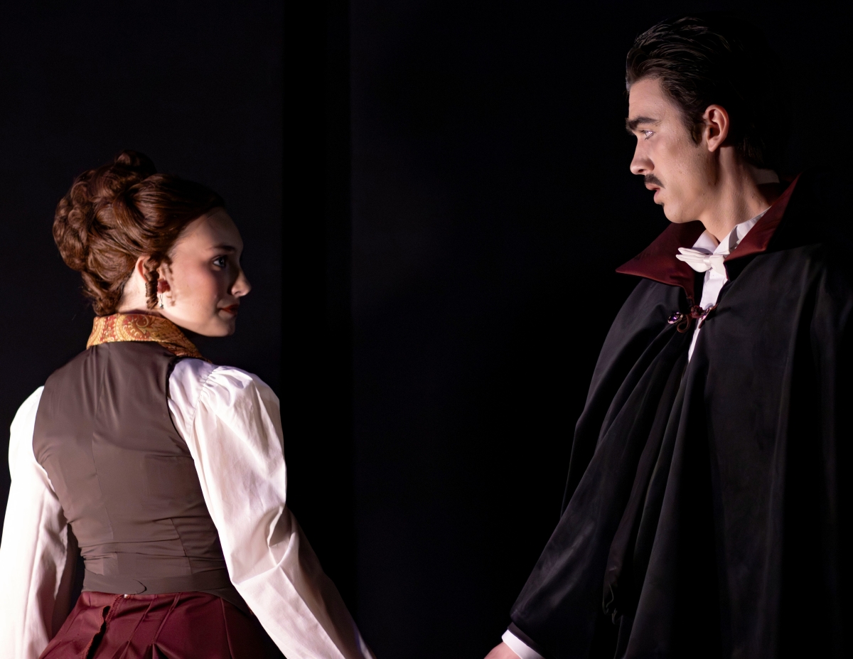 Mina (brunette, in the gold/brown vest) is played by sophomore Theatre major Cameron Schulz. Dracula is played by sophomore Theatre minor Liam Phillips.