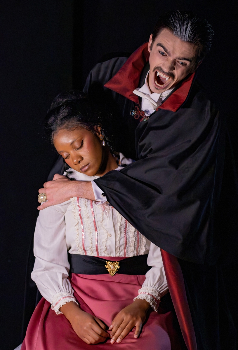Dracula is played by sophomore Theatre minor Liam Phillips. Lucy (white lacy top with pink trim) is played by junior Theatre major Kyra Hollmon.