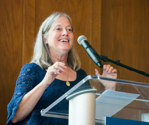 Honors College Dean Linda Frost talking at a podium.
