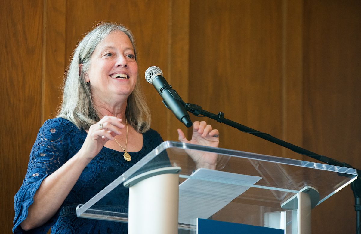 Honors College Dean Linda Frost talking at a podium in the Guerry Center Reading Room.