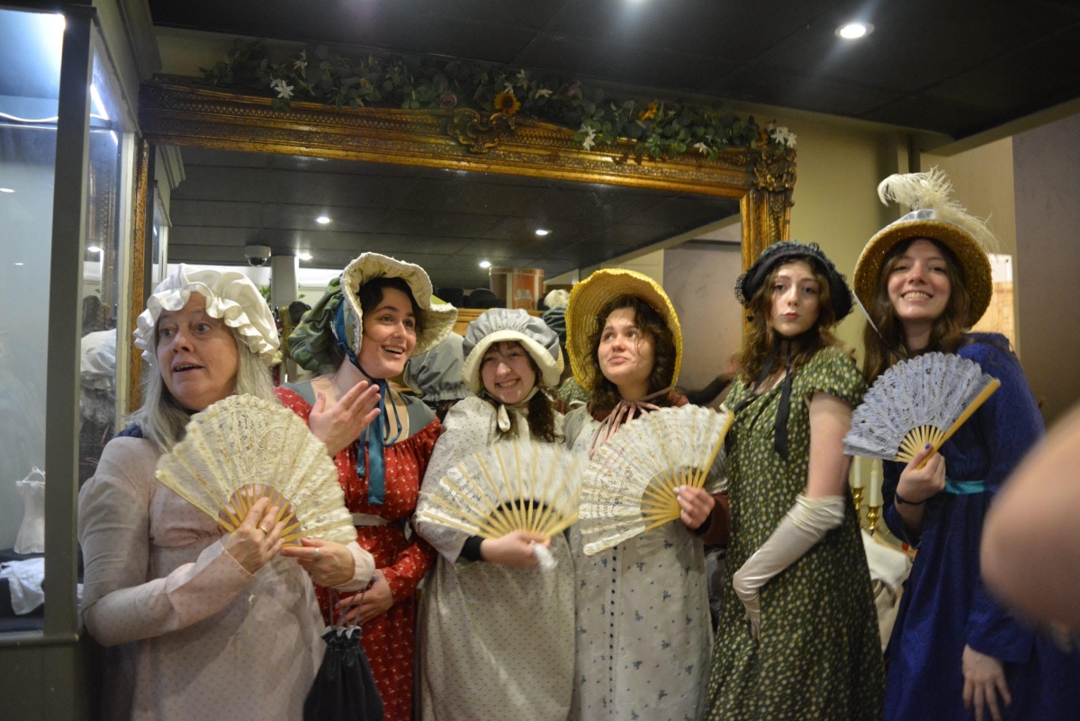 During a spring break 2024 study abroad excursion to England, Honors College Dean Linda Frost, left, and students in the UTC travel party modeled Regency-era clothes at the Jane Austen Center.