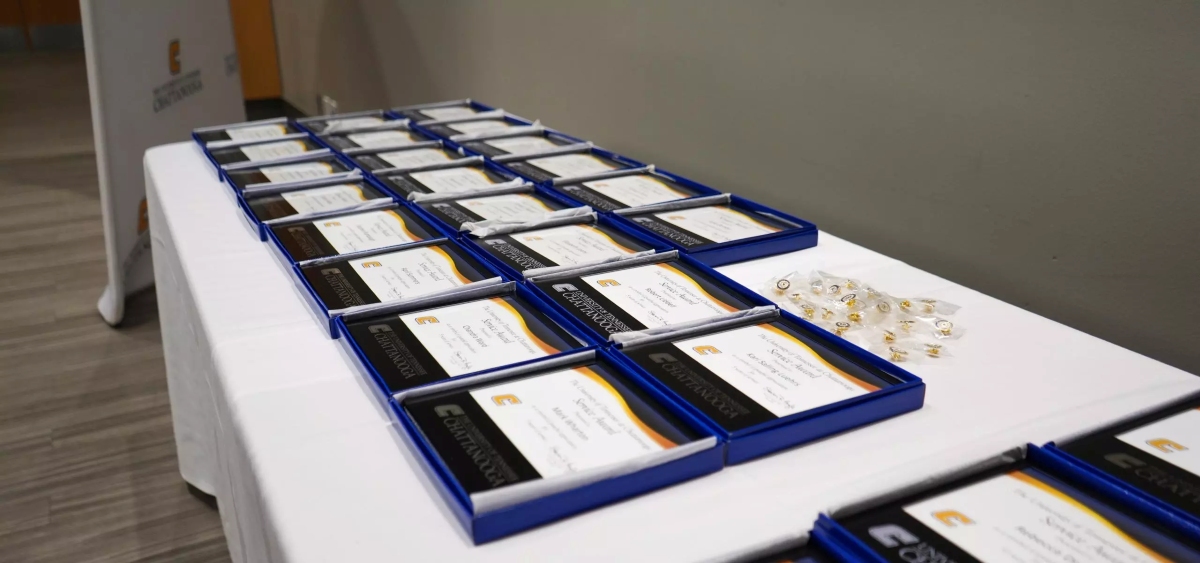 A table full of Service Award plaques