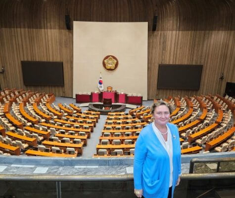 Dr. Irina Khmelko stands in the South Korean Parliament