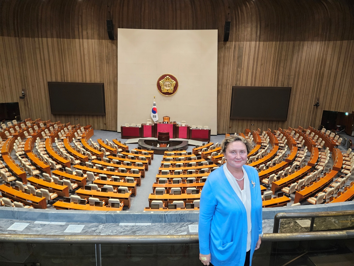 Dr. Irina Khmelko stands in the South Korean Parliament