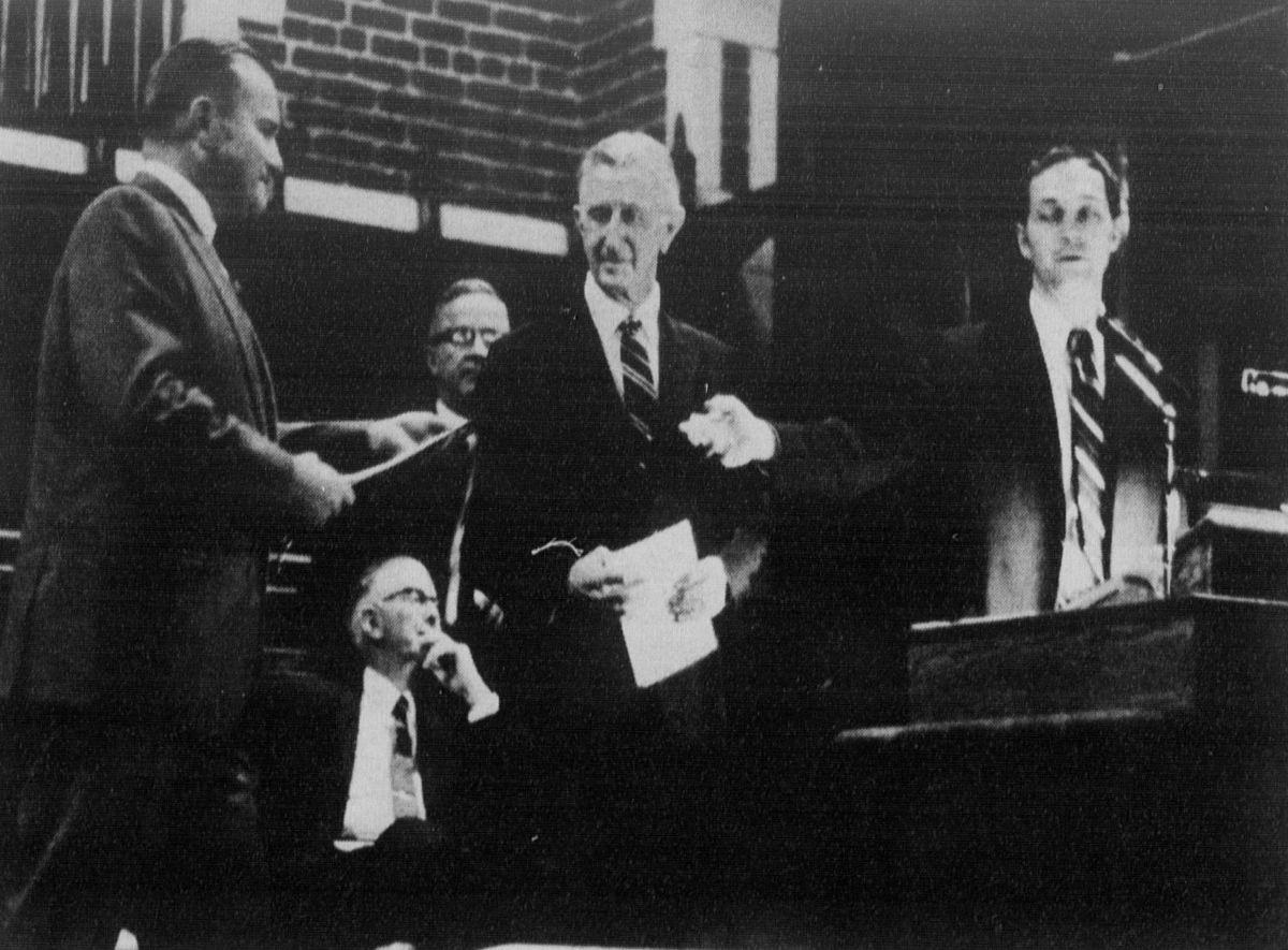 Black-and-white photograph of University of Tennessee System President Andy Holt (center) accepting the master key to Grote Hall
