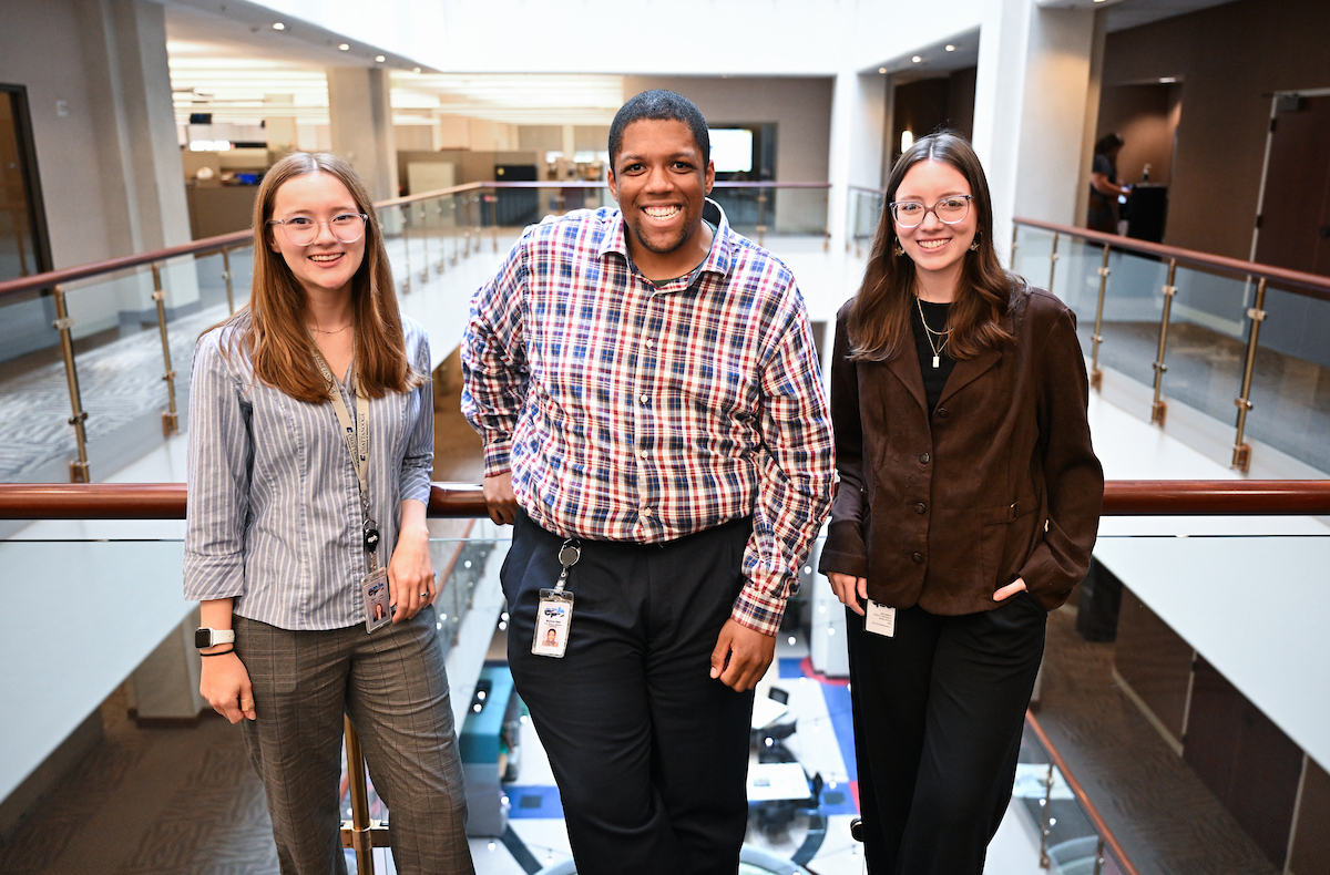 Gracie Crooks, Mychael Allen-Fennessee and Ainsley Henderson stand at EPB