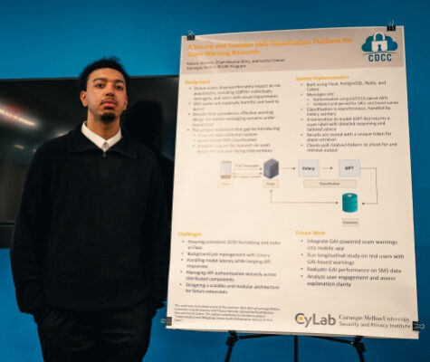 Fabion Walden stands next to his poster about protecting users from spam