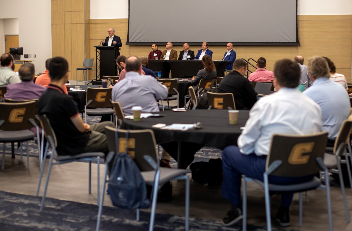 Keynote panelists on the stage at the POWA Conference