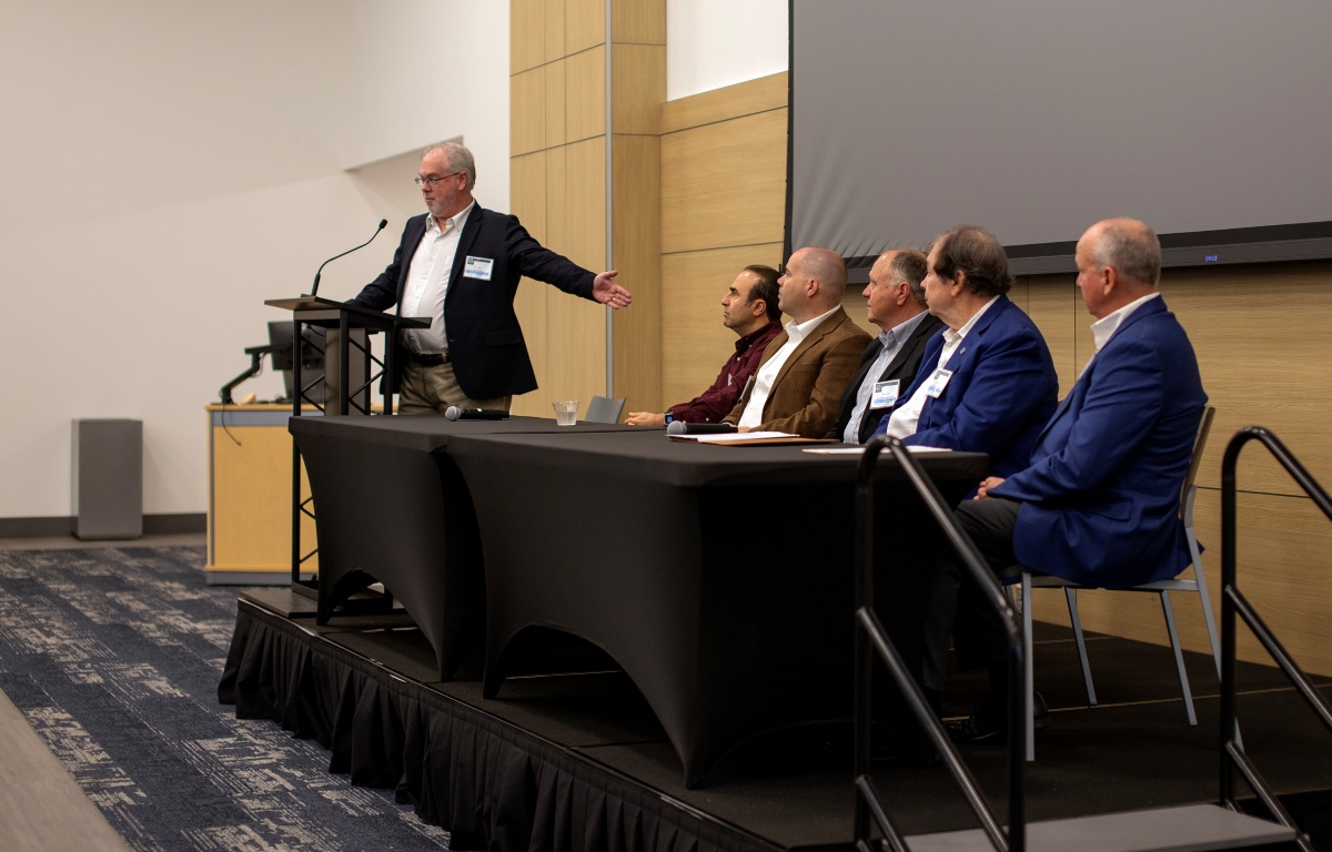 Keynote panelists on the stage at the POWA Conference
